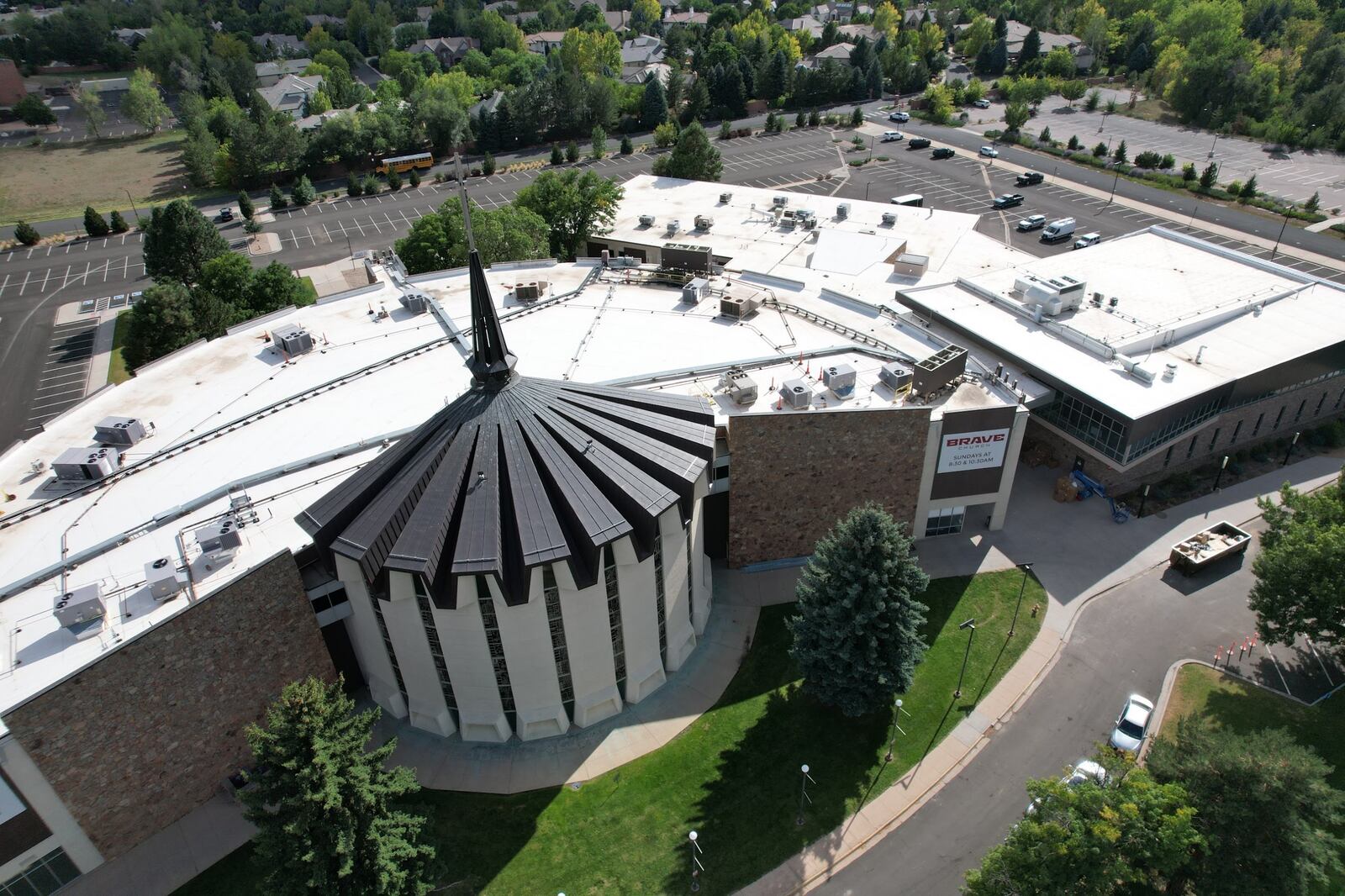 White reflective TPO membrane roofs on a large building, seen from above