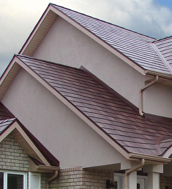 ARCM Roofing team member reviewing a roof inspection