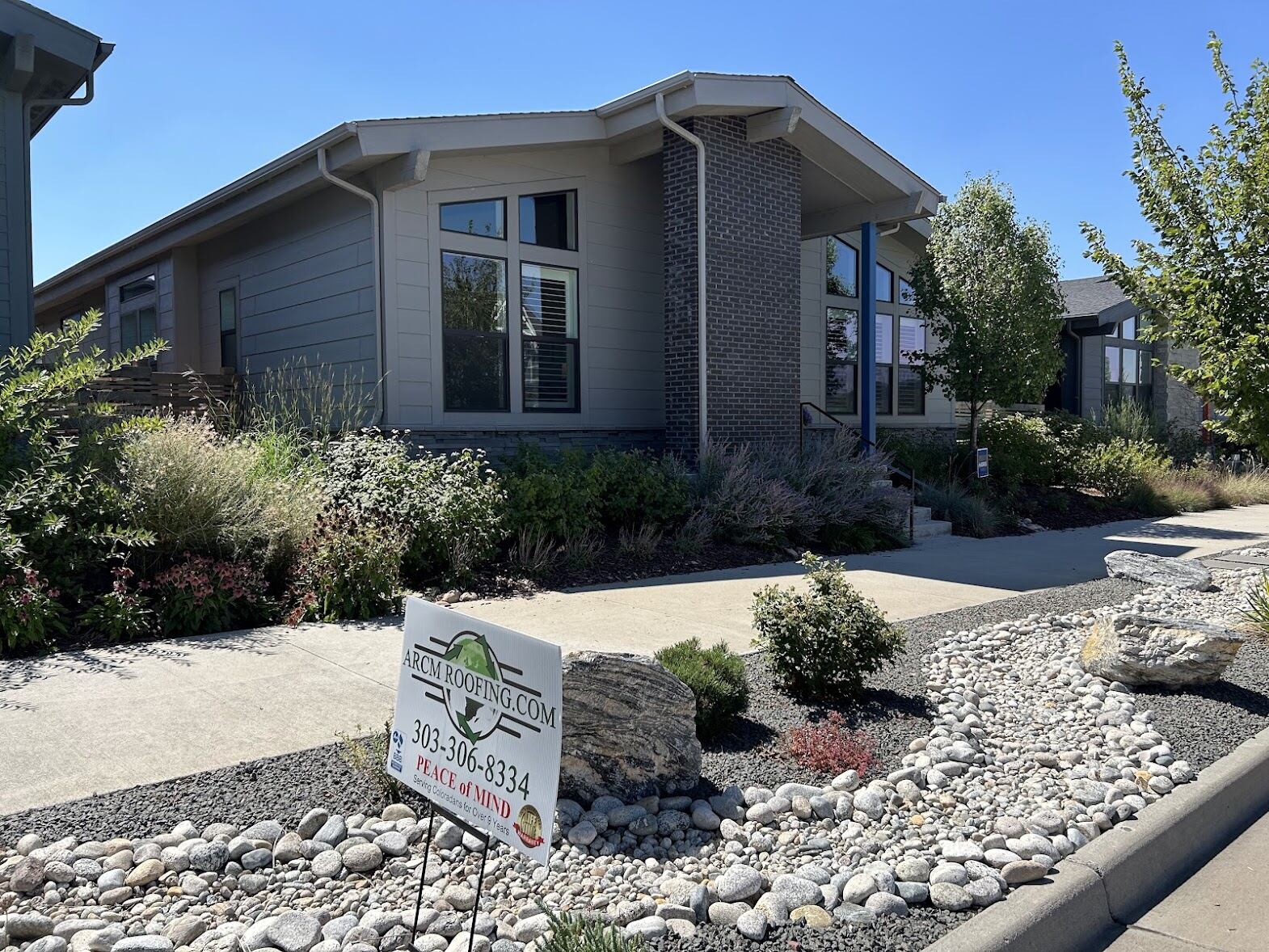 Home in Brighton, Colorado with a freshly installed asphalt shingle roof by ARCM Roofing