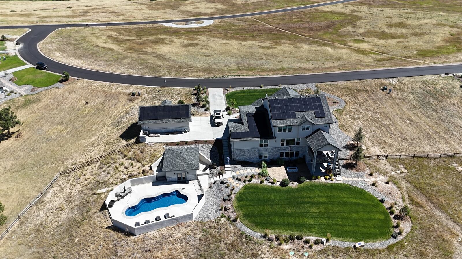 Large two-story home in Castle Pines, Colorado with a new asphalt shingle roof by ARCM Roofing