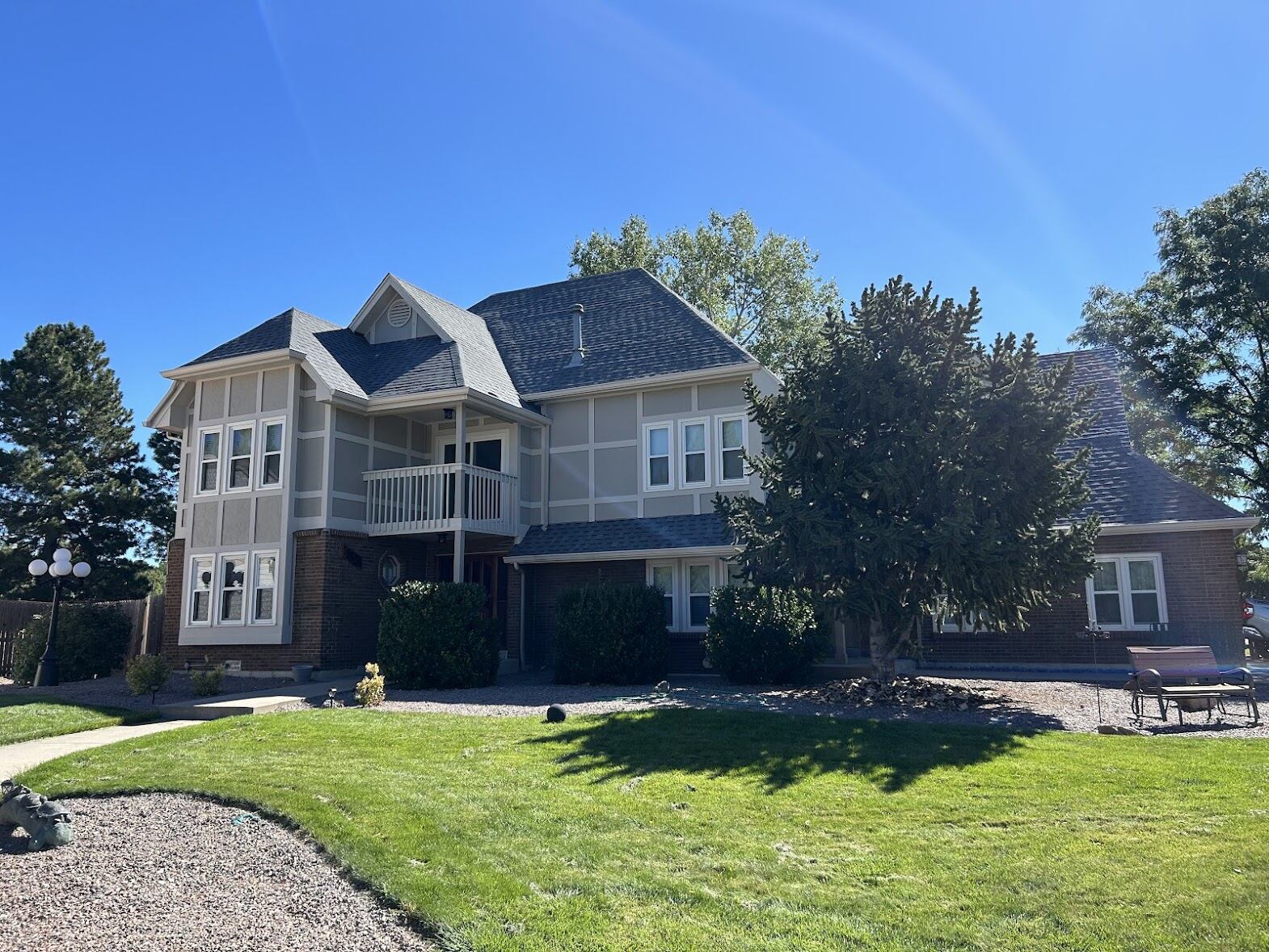 Two-story home in Highlands Ranch, Colorado with a completed roof replacement by ARCM Roofing