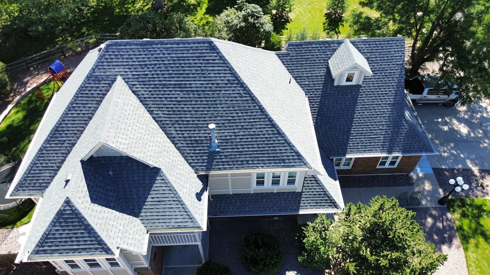 Home in Longmont, Colorado with a completed asphalt shingle roof replacement by ARCM Roofing